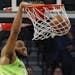 Minnesota Timberwolves' Karl-Anthony Towns dunks against the New Orleans Pelicans watch the second half of an NBA basketball game Saturday, Jan. 12, 2