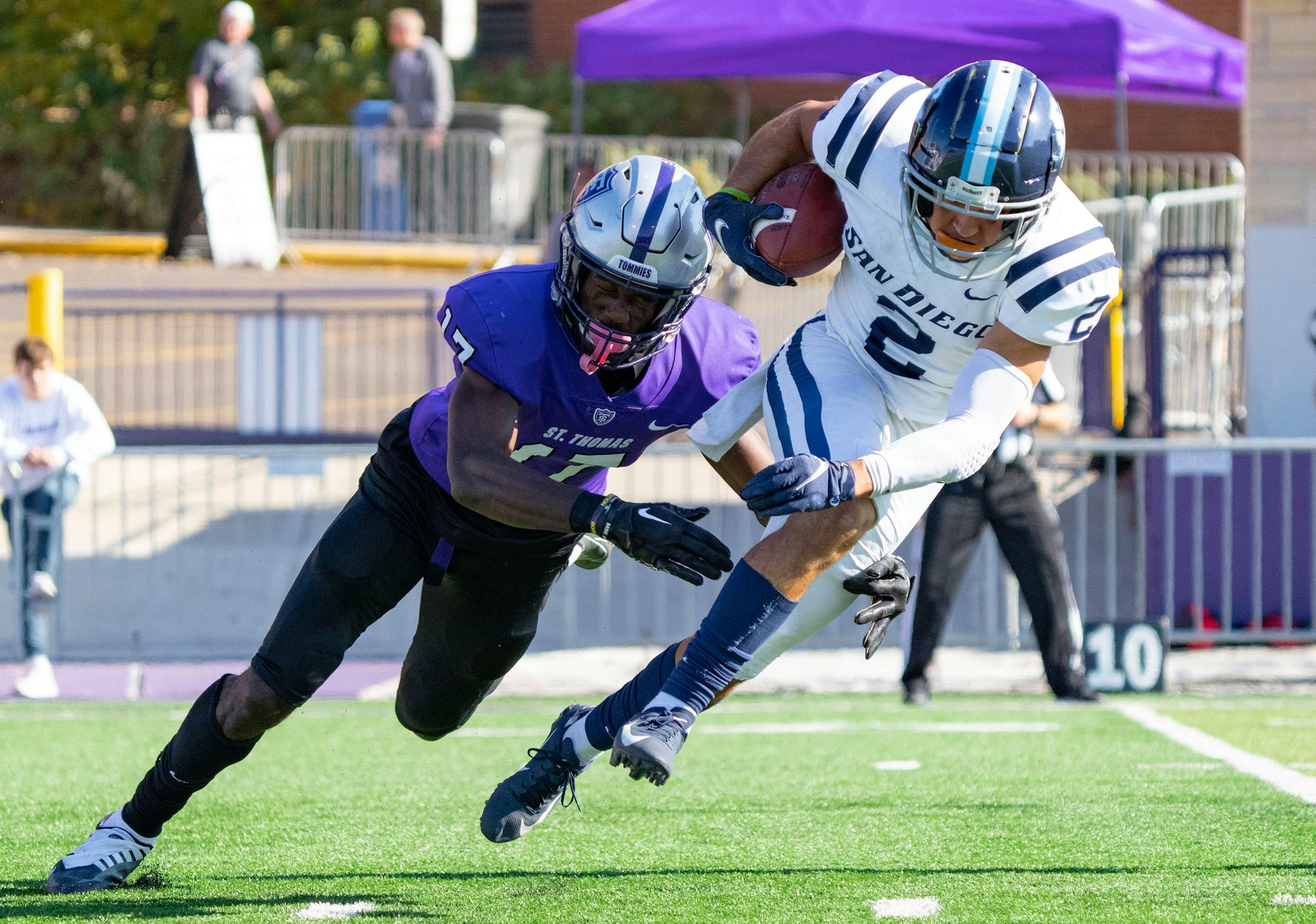 St. Thomas wide receiver Andrew McElroy (17)  attempts to tackle San Diego Toreros cornerback Eric Haney (2) during an eventual 77-yard punt return in the second quarter.