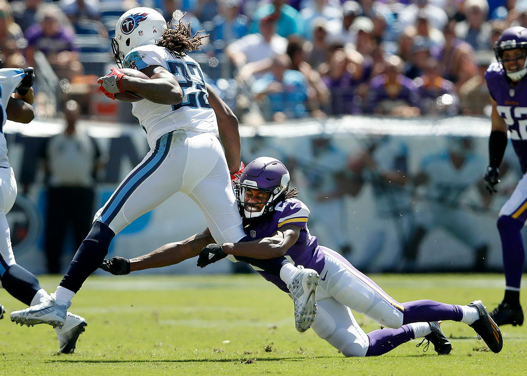 Trae Waynes (26) tackled Derrick Henry (22) for a loos in the second quarter.