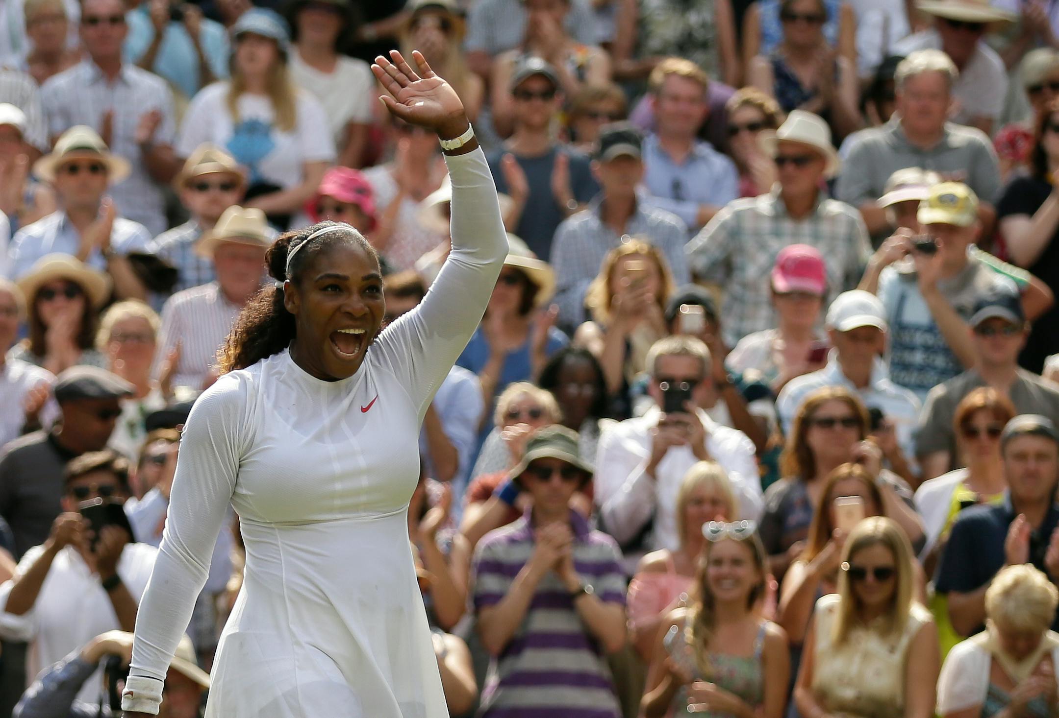Serena Williams celebrates defeating Germany's Julia Gorges in their women's singles semifinals match at Wimbledon