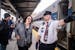 Conductor Robert Vogds welcomes passengers as  Amtrak’s Boprealis daily service to Chicago begins from St. Paul’s Union Depot in St. Paul, Minn., 