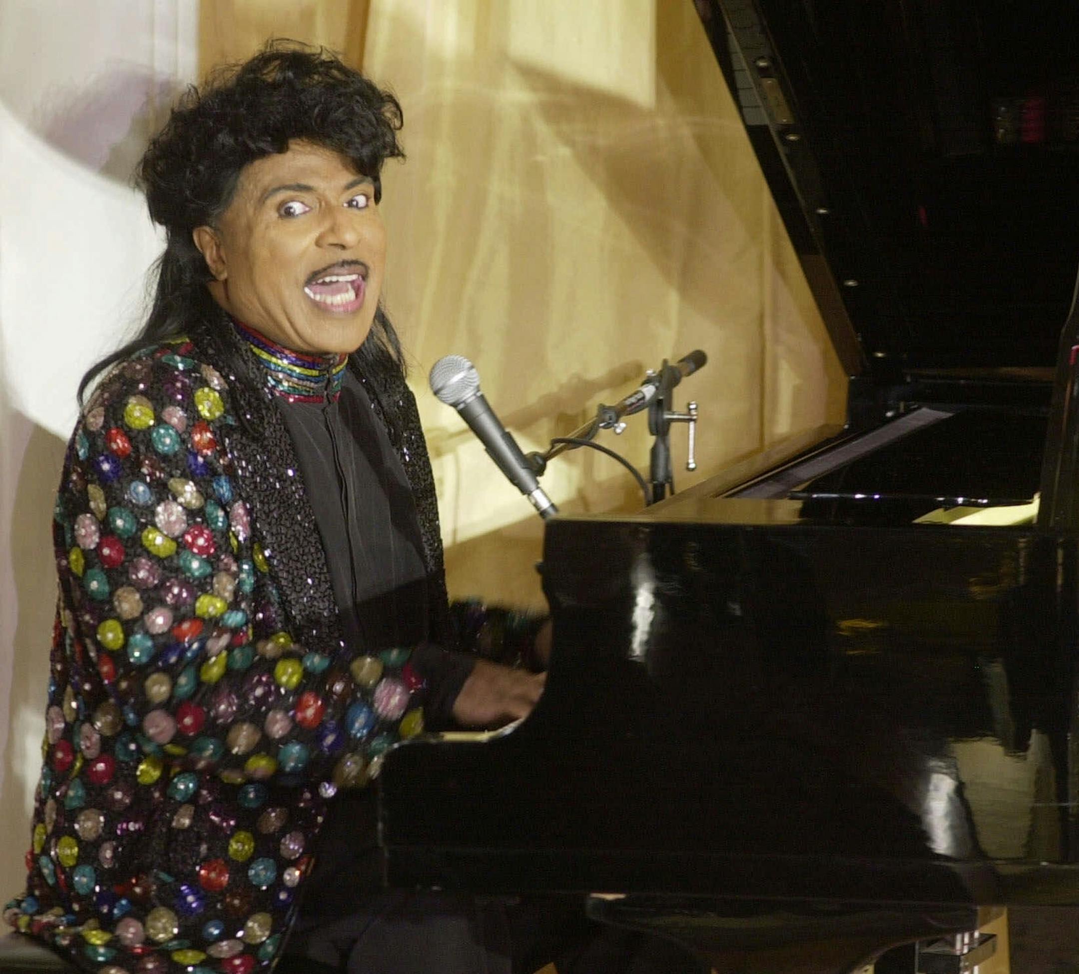 FILE - In this July 22, 2001 file photo, Little Richard performs at the 93rd birthday and 88th year in show business gala celebration for Milton Berle, in Beverly Hills, Calif. Little Richard, the self-proclaimed “architect of rock ‘n’ roll” whose piercing wail, pounding piano and towering pompadour irrevocably altered popular music while introducing black R&B to white America, has died Saturday, May 9, 2020. (AP Photo/John Hayes, File)