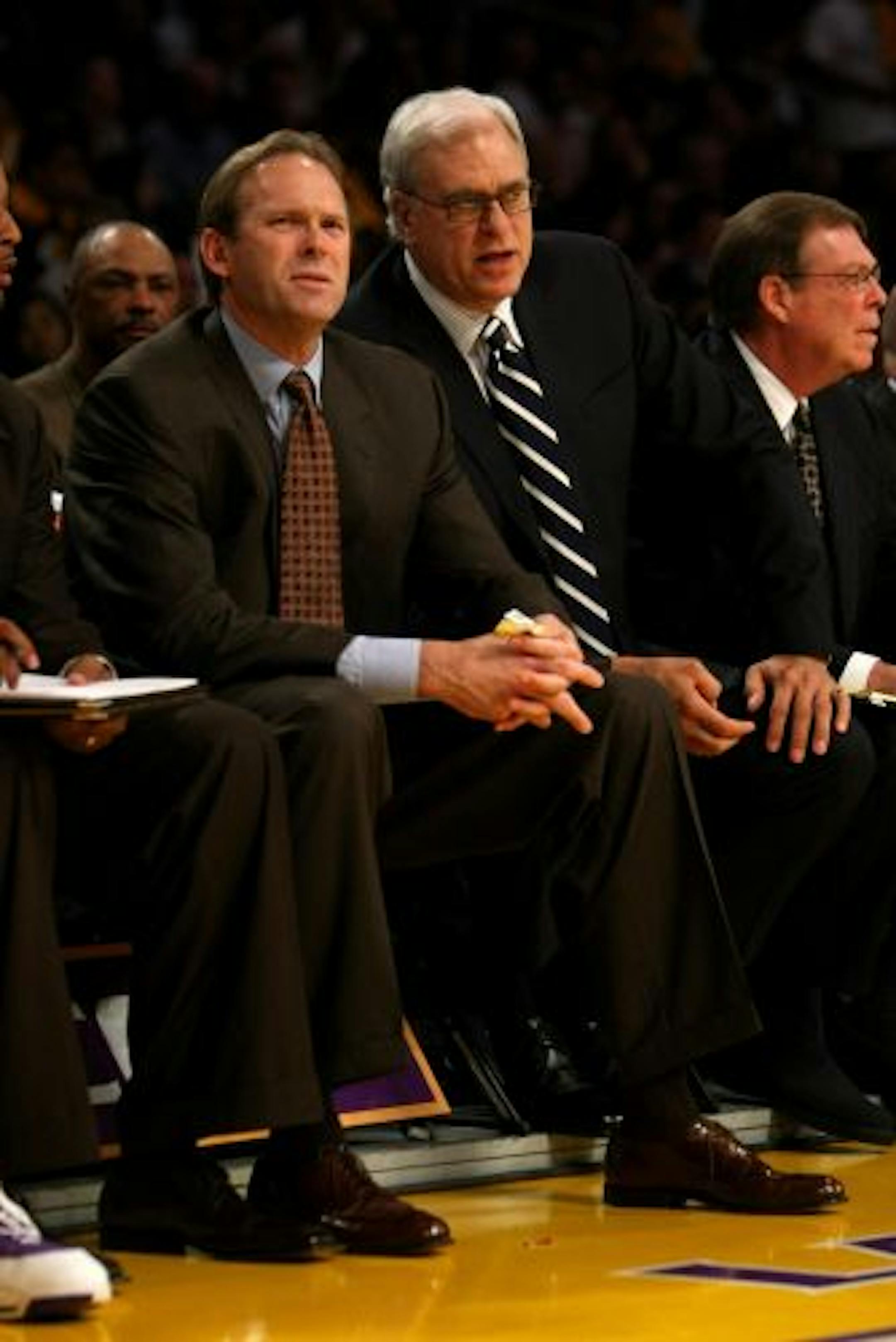 Kurt Rambis (left) rode shotgun to coach Phil Jackson as the Lakers won the NBA title this year. Rambis has emerged as the front-runner for the Timberwolves coaching job and could be hired as soon as today.