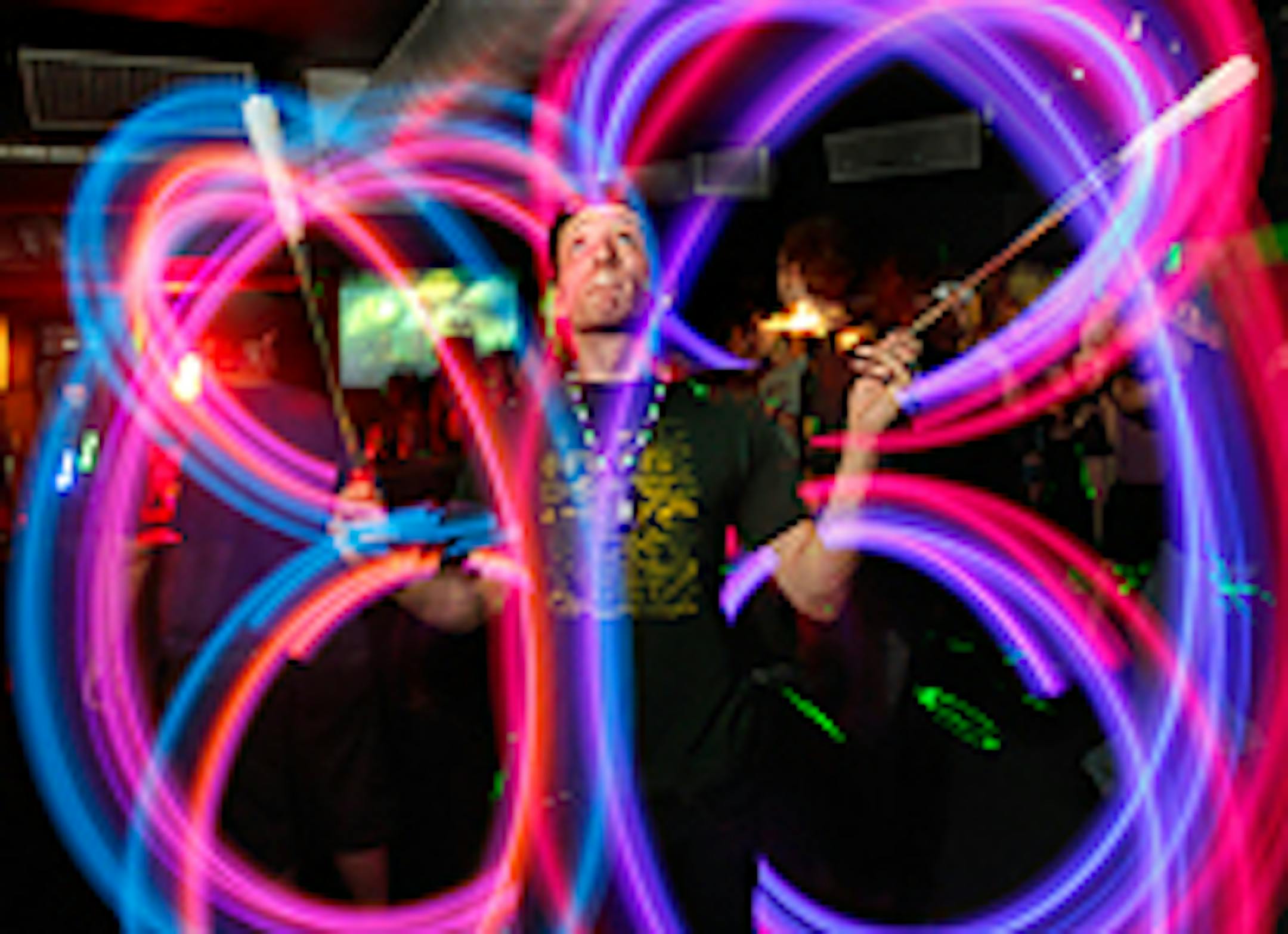 Justin T. Reiman, aka "Wings," spins lights during Konkrete Jungle at First Ave's Record Room