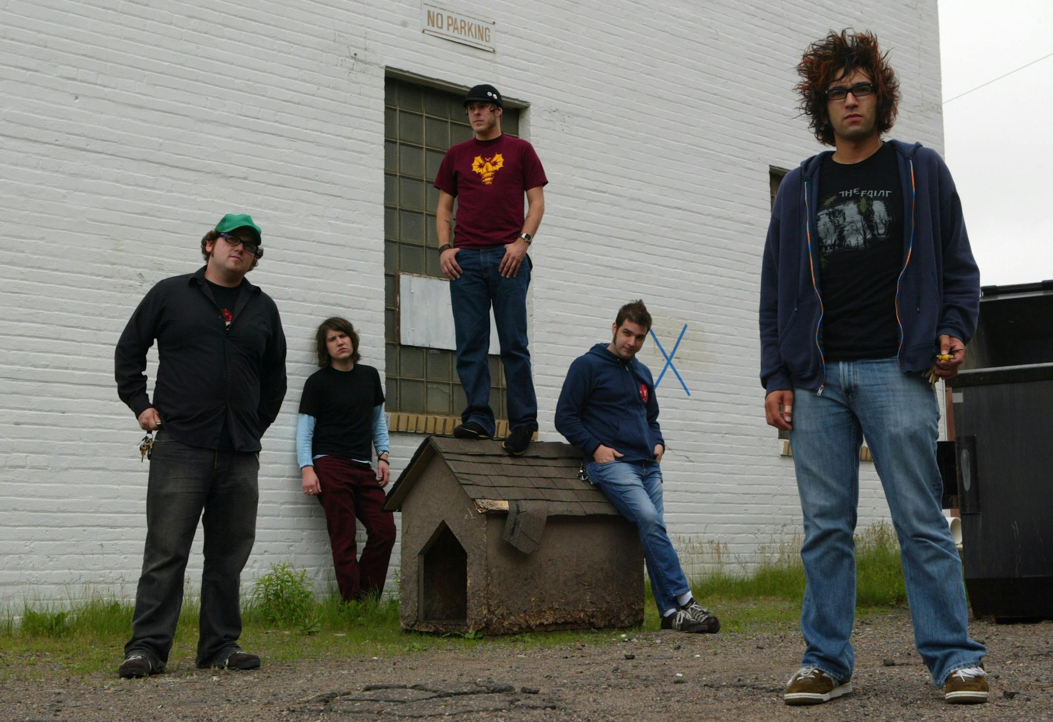 The Motion City Soundrack members near their rehearsal space in St. Paul Tuesday afternoon. They are, from left, Josh Cain, Matt Taylor, Jesse Johnson, Tony Thaxton, and Justin Pierre.
GENERAL INFORMATION: ST. PAUL - 6/10/03 - The local band Motion City Soundtrack, who are about to release their debut on the nationally-renowned punk rock label Epitaph Records and yet aren't very well known locally.