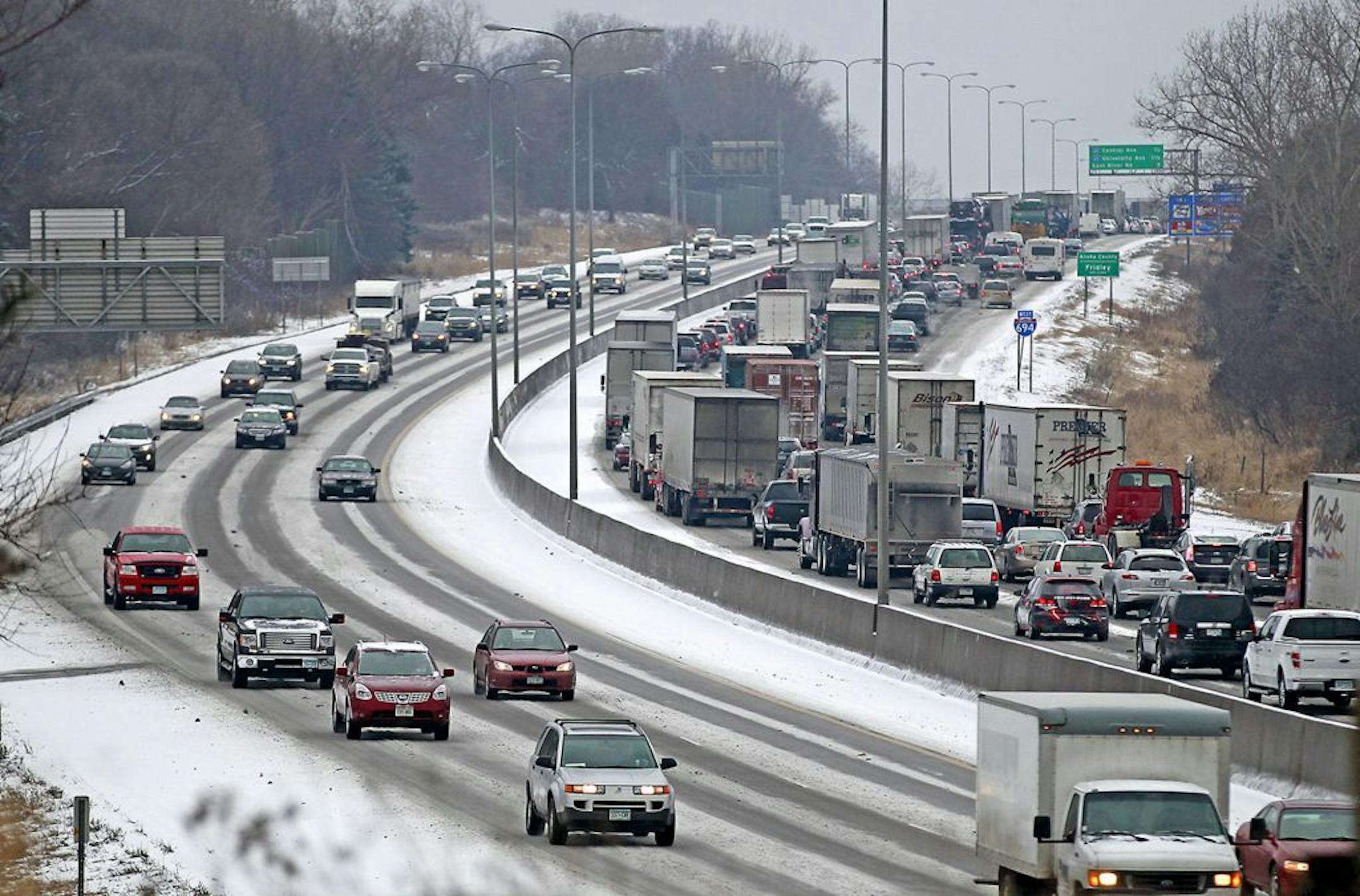 An accident involving a semi-truck slowed traffic on 694 Westbound due to snow and freezing rain, Tuesday, February 10, 2015, near Minnetonka, MN.