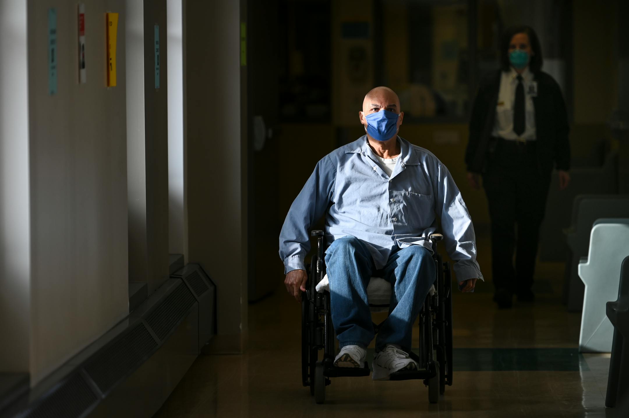 Inmate Emmett Thomas, 68, carted himself back toward his living area after receiving a COVID-19 vaccination.