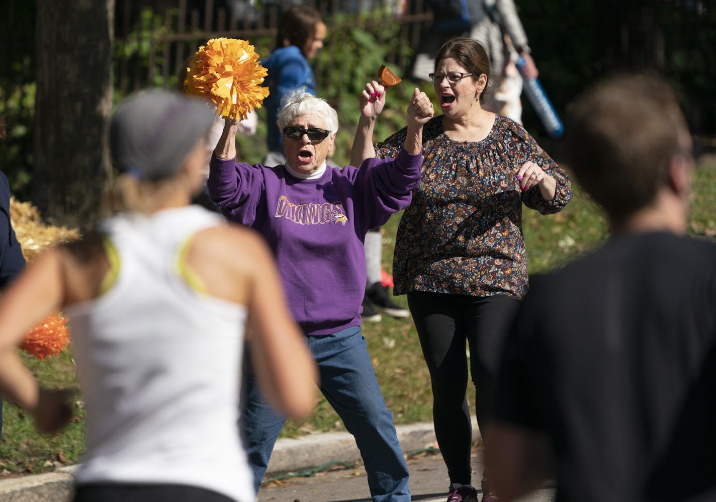 Jean Ford and Marianne Kipp enthusiastically danced on the side of the road near mile 26 during the 2019 Medtronic Twin Cities Marathon in St. Paul, Minn., on Sunday, October 6, 2019. ] RENEE JONES SCHNEIDER &#xa5; renee.jones@startribune.com