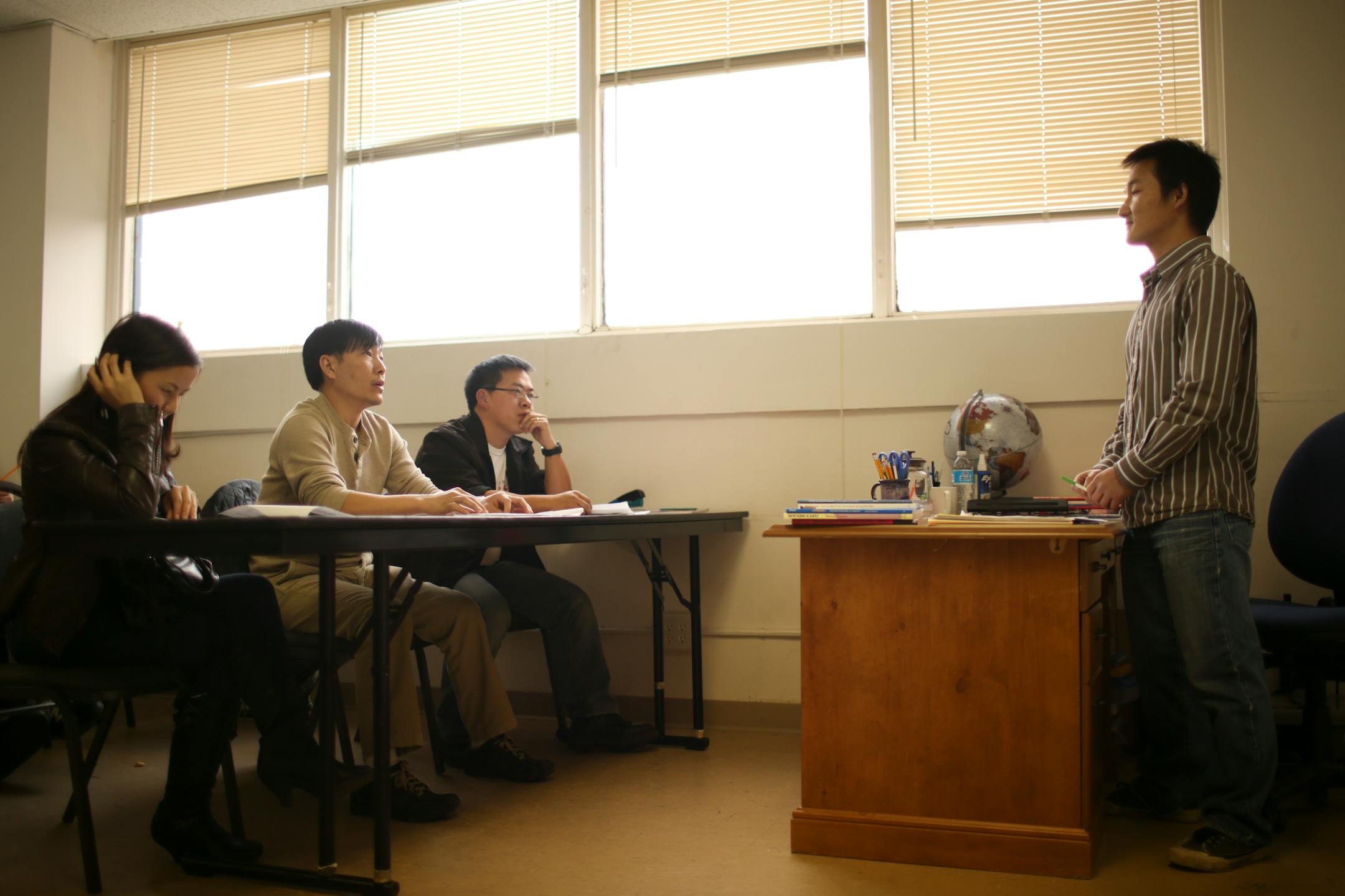 Xiong Lor, Poua Chang, and Chai Xiong, from left, were among those in the U.S. citizenship class taught by Ying Lor, right, at the Hmong Cultural Center of Minnesota Wednesday afternoon.
