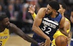 Los Angeles Lakers guard Lance Stephenson (6) grabbed Minnesota Timberwolves center Karl-Anthony Towns' finger after they fought for a rebound in the 