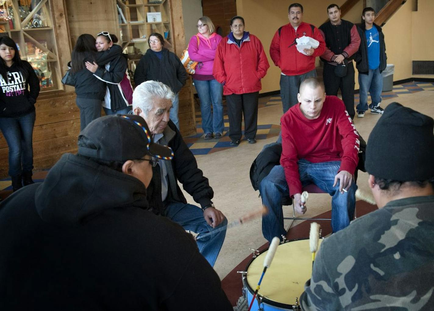 Whitney Spears, Leah Cook and Ashley Lajeunesse, upper left, got emotional during a drumming ceremony in Minneapolis before they headed to Newtown, Conn. They hoped that their experiences might help them offer comfort to survivors who lost friends and loved ones.