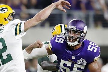 Anthony Barr chases Packers quarterback Aaron Rodgers during a game last season.