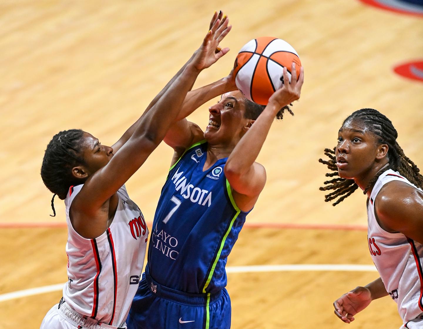 Washington Mystics center Tina Charles, left, defends against The Lynx's Layshia Clarendon during the first half.