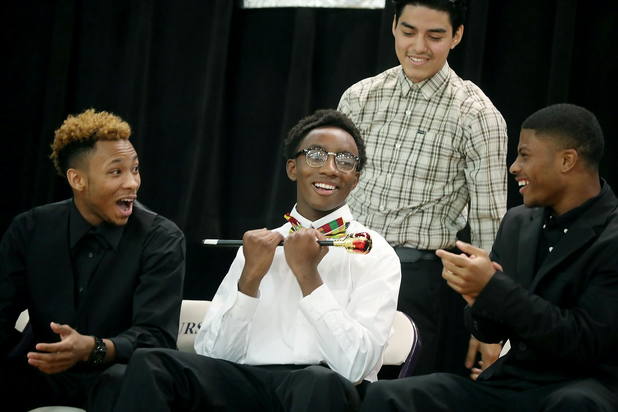 Roland Osiagiade, center, was named Homecoming Prince at the High School, Monday, October 11, 2016 in Brooklyn Center, MN. He was seated next to court members DeShawn Pickford, left, and Tyler Miller, right.