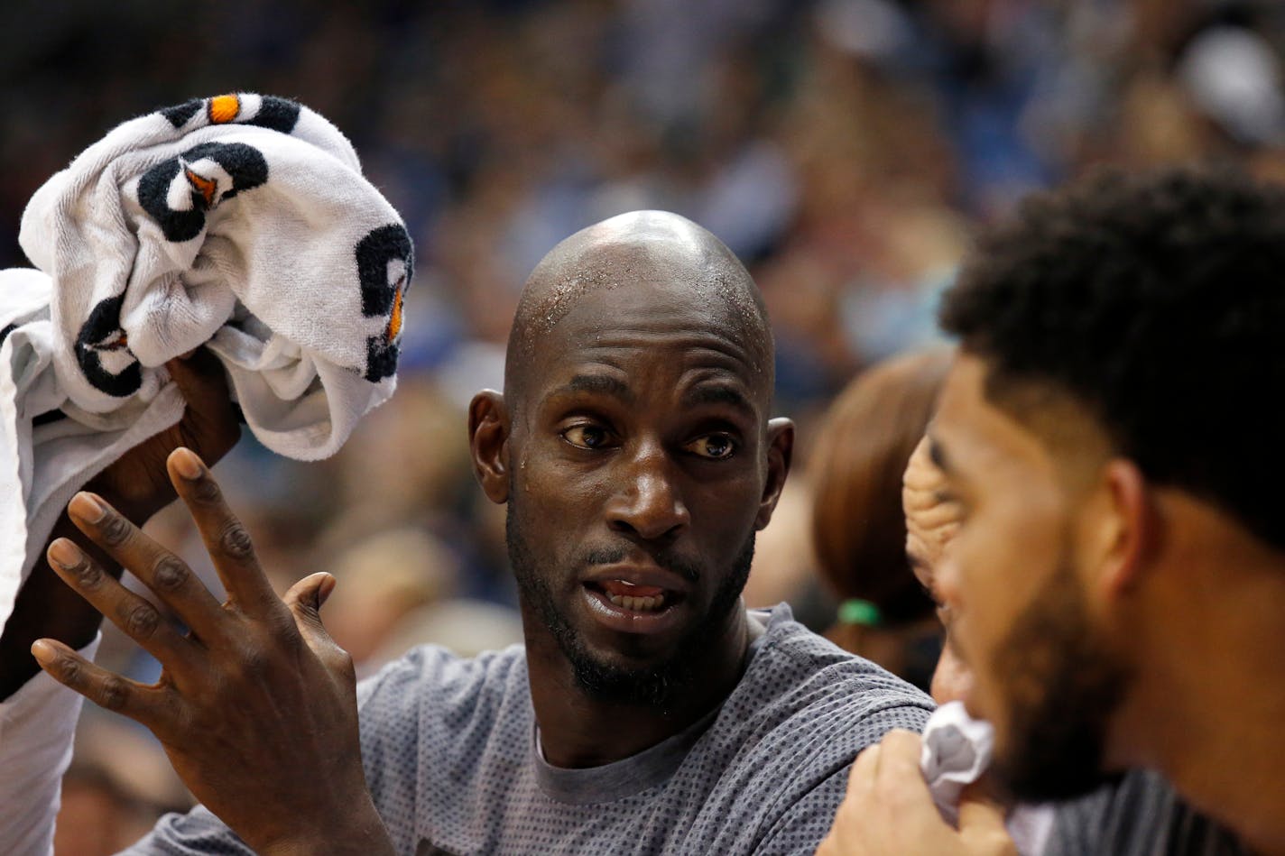 In this Nov. 15, 2015, file photo, Timberwolves forward Kevin Garnett, left, talks with Karl-Anthony Towns