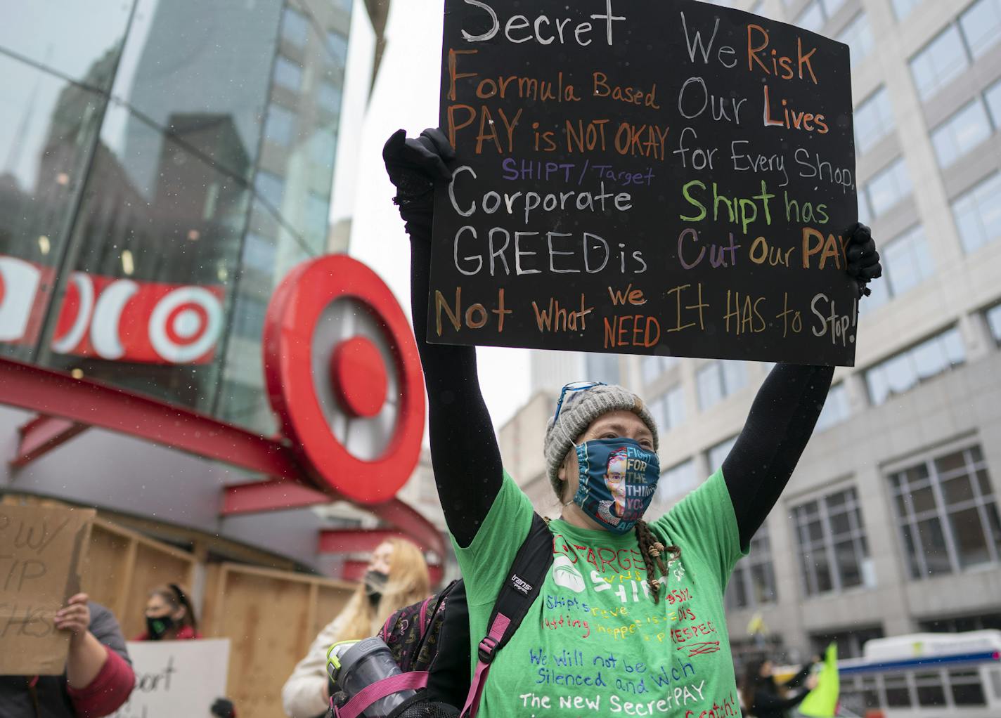 Shoppers for Target-owned delivery company Shipt staged a protest Monday walking from the Target store in downtown Minneapolis to the company's downtown headquarters. Workers say a recent change to the algorithm that determines how much they are paid has lowered their pay. Here, Kris Beedle, who is a shipped shopper at the West St. Paul Target store, voiced her anger over recent pay cuts. brian.peterson@startribune.com Minneapolis, MN Monday, October 19, 2020