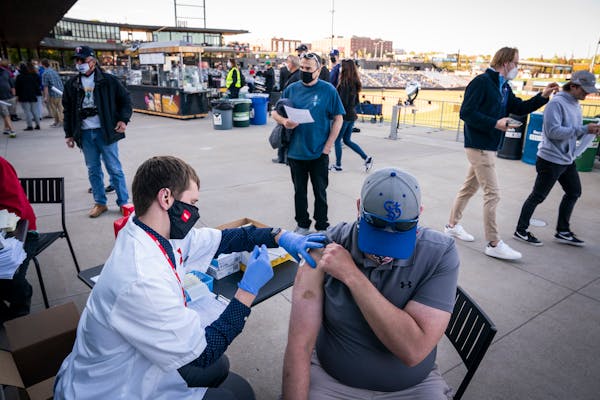 Matt Anderson of West St Paul got the Johnson &amp; Johnson COVID-19 vaccine at the St. Paul Saints home opener in St. Paul on Tuesday.
