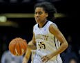 Marquette guard Kenisha Bell (15) dribbles against Providence during an NCAA college basketball game in the first round of the Big East Conference tou