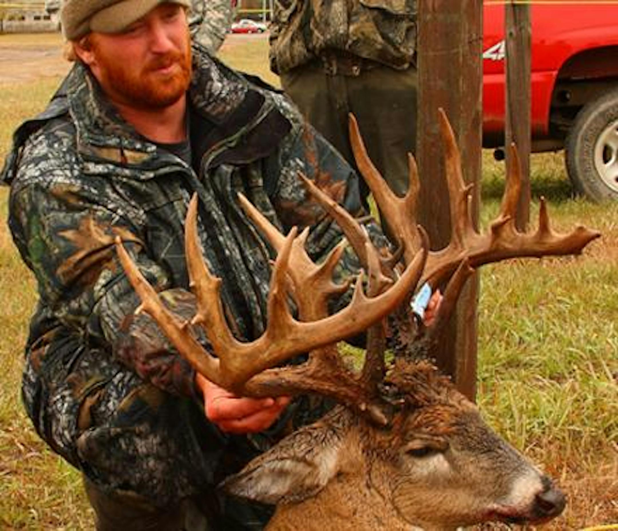 Scott O'Konek, 29, with his 32 point Camp Ripley buck