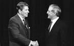 FILE - In this Oct. 22, 1984, file photo, President Ronald Reagan, left, and his Democratic challenger Walter Mondale, shake hands prior to their tele