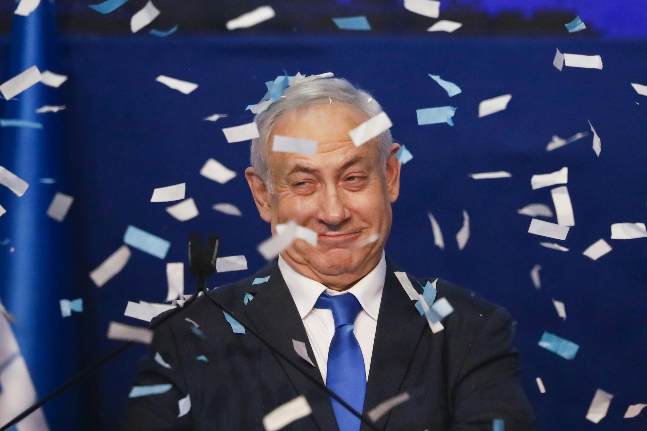 Israeli Prime Minister Benjamin Netanyahu smiles after first exit poll results for the Israeli elections at his party's headquarters in Tel Aviv, Israel, Monday, March 2, 2020. (AP Photo/Ariel Schalit)