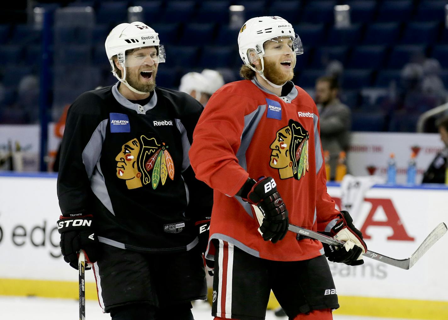 Chicago Blackhawks defenseman Kimmo Timonen, left, right wing Patrick Kane laugh during practice at the NHL hockey Stanley Cup Final, Friday, June 5, 2015, in Tampa, Fla. The Chicago Blackhawks lead the best-of-seven games series against the Tampa Bay Lightning 1-0. Game 2 is scheduled for Saturday night. (AP Photo/Chris Carlson)