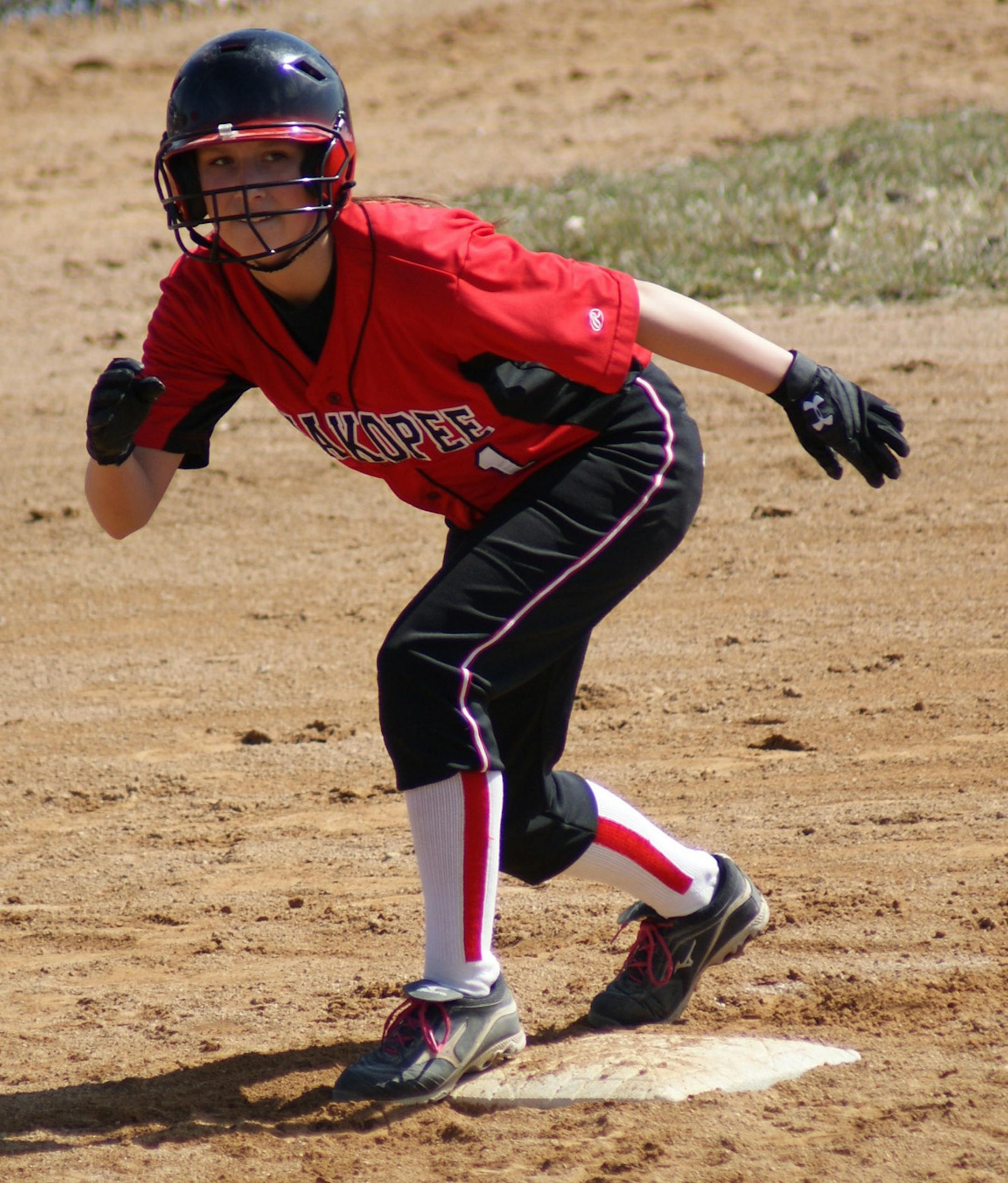 Picture 4: Shakopee junior Kiley Rondeau (1) keeps a close eye on the pitcher as she stands on third base.