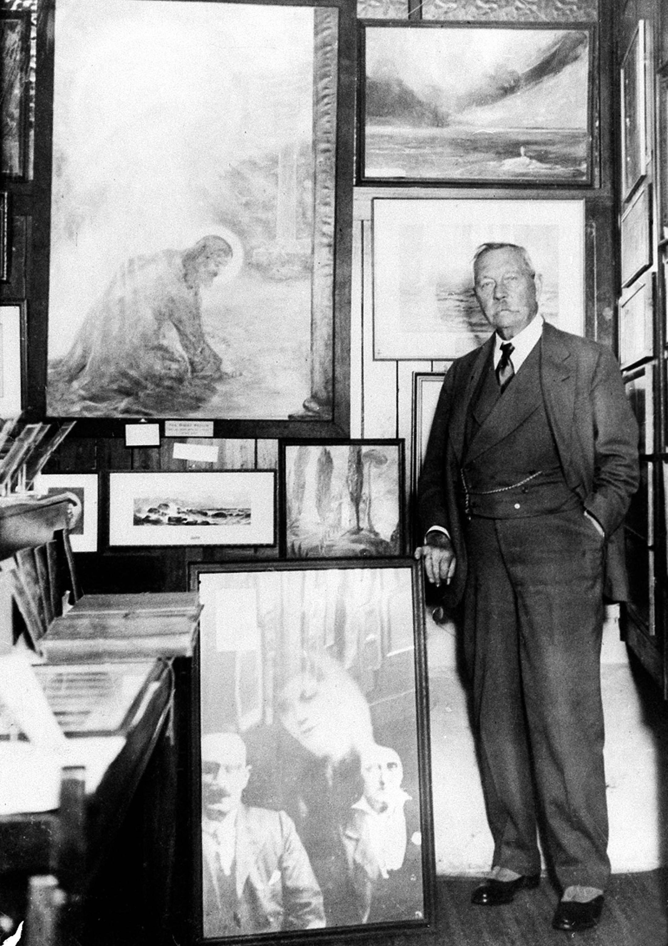 Arthur Conan Doyle with his psychic pictures in his spiritist museum near Westminster Abbey in 1928.