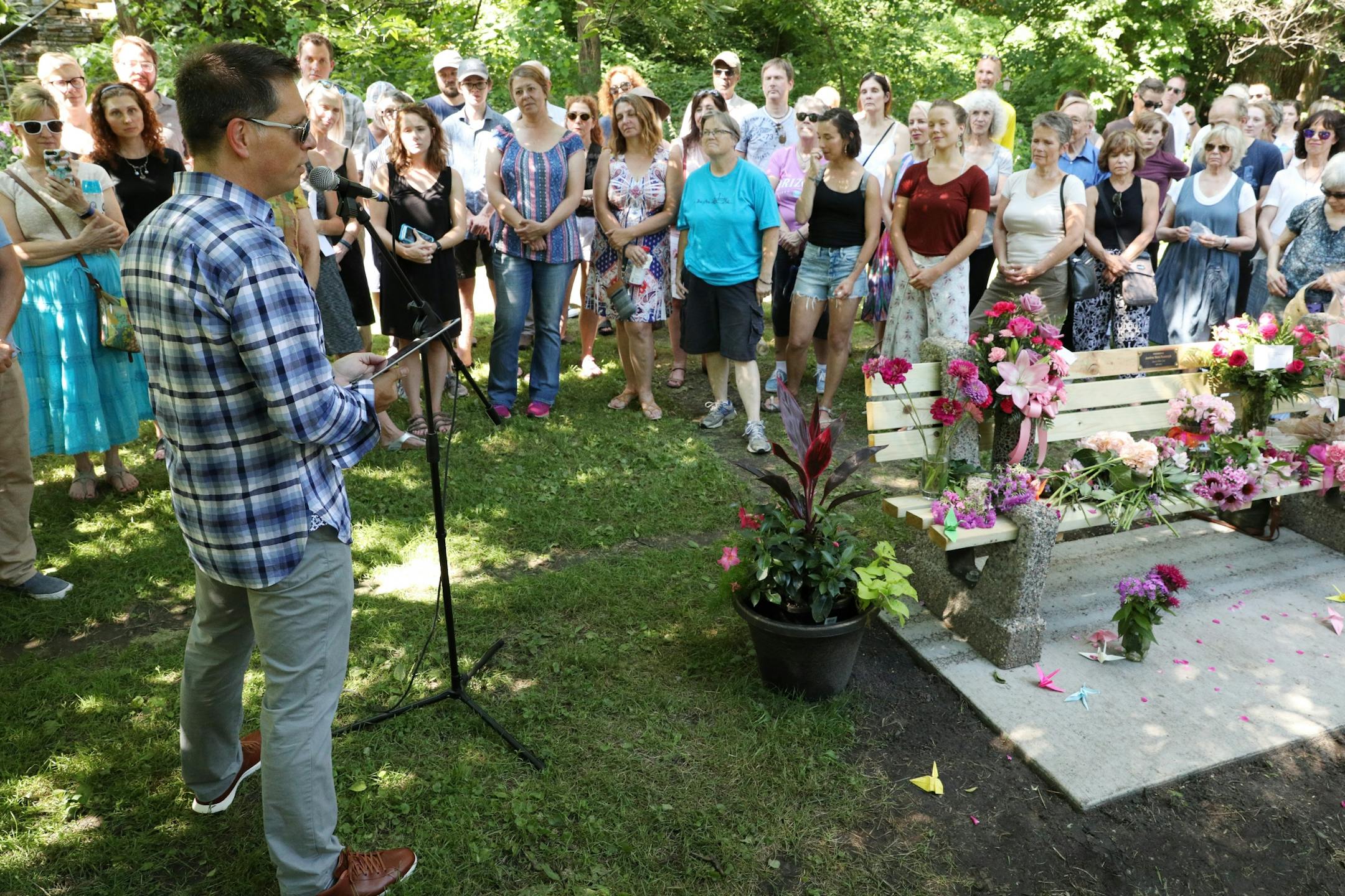 Don Damond spoke to the crowd of friends and family that gathered to dedicate a bench to Justine Ruszczyk Damond at Minnehaha Creek between 53rd and 54th streets on the one year anniversary of her death.