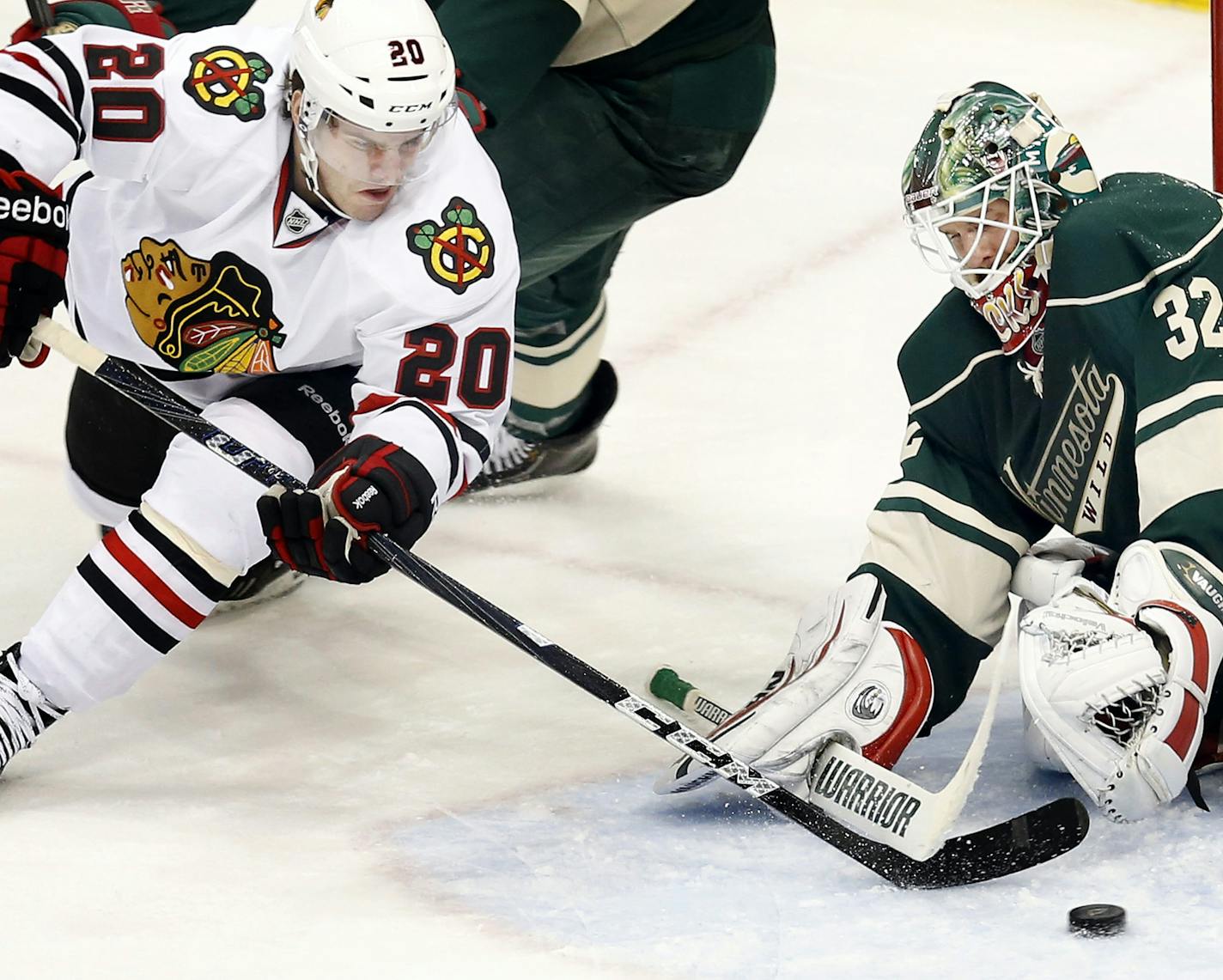 Minnesota Wild goalie Niklas Backstrom (32) makes a save against the Chicago Blackhawks' Brandon Saad (20) in the third period at Xcel Energy Center in St. Paul, Minnesota, on Tuesday, April 9, 2013. Chicago won, 1-0. (Carlos Gonzalez/Minneapolis Star Tribune/MCT) ORG XMIT: 1137329 ORG XMIT: MIN1304092238540317