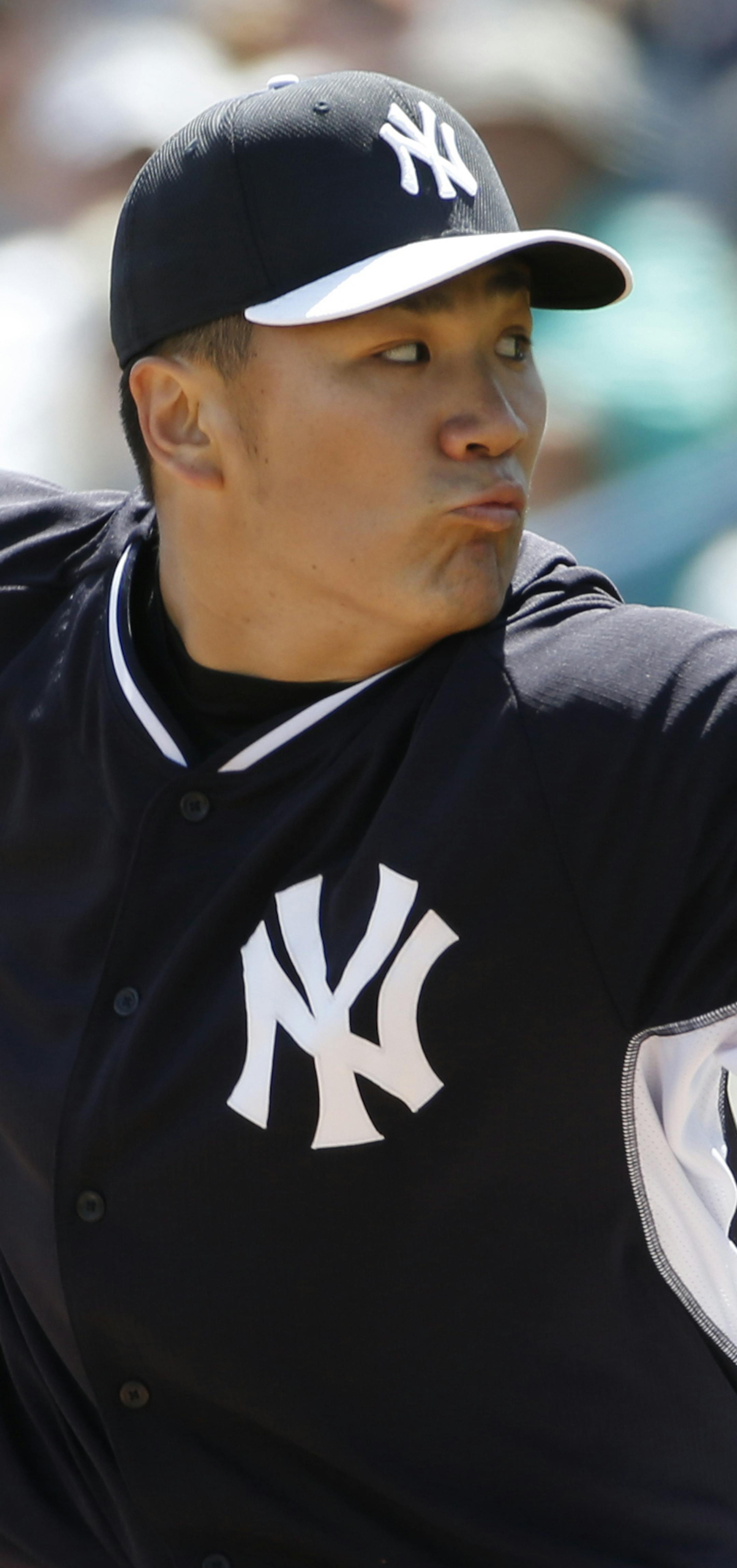New York Yankees starting pitcher Masahiro Tanaka delivers in the first inning of a spring exhibition baseball game against the Atlanta Braves in Tampa, Fla., Sunday, March 16, 2014. (AP Photo/Kathy Willens)