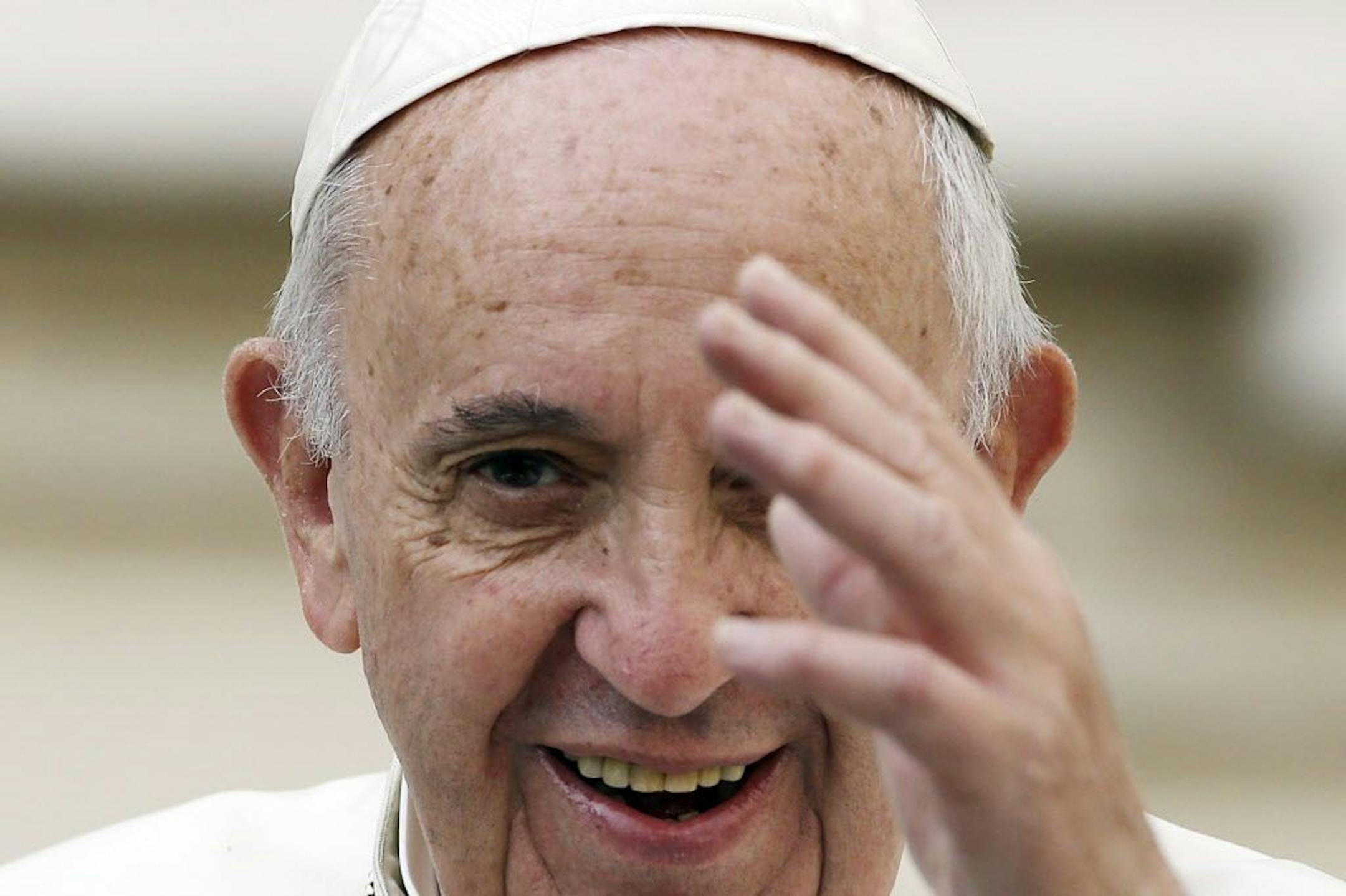 Pope Francis delivers his blessing as he arrives in St. Peter's Square for his weekly general audience, at the Vatican, Wednesday, Oct. 14, 2015.