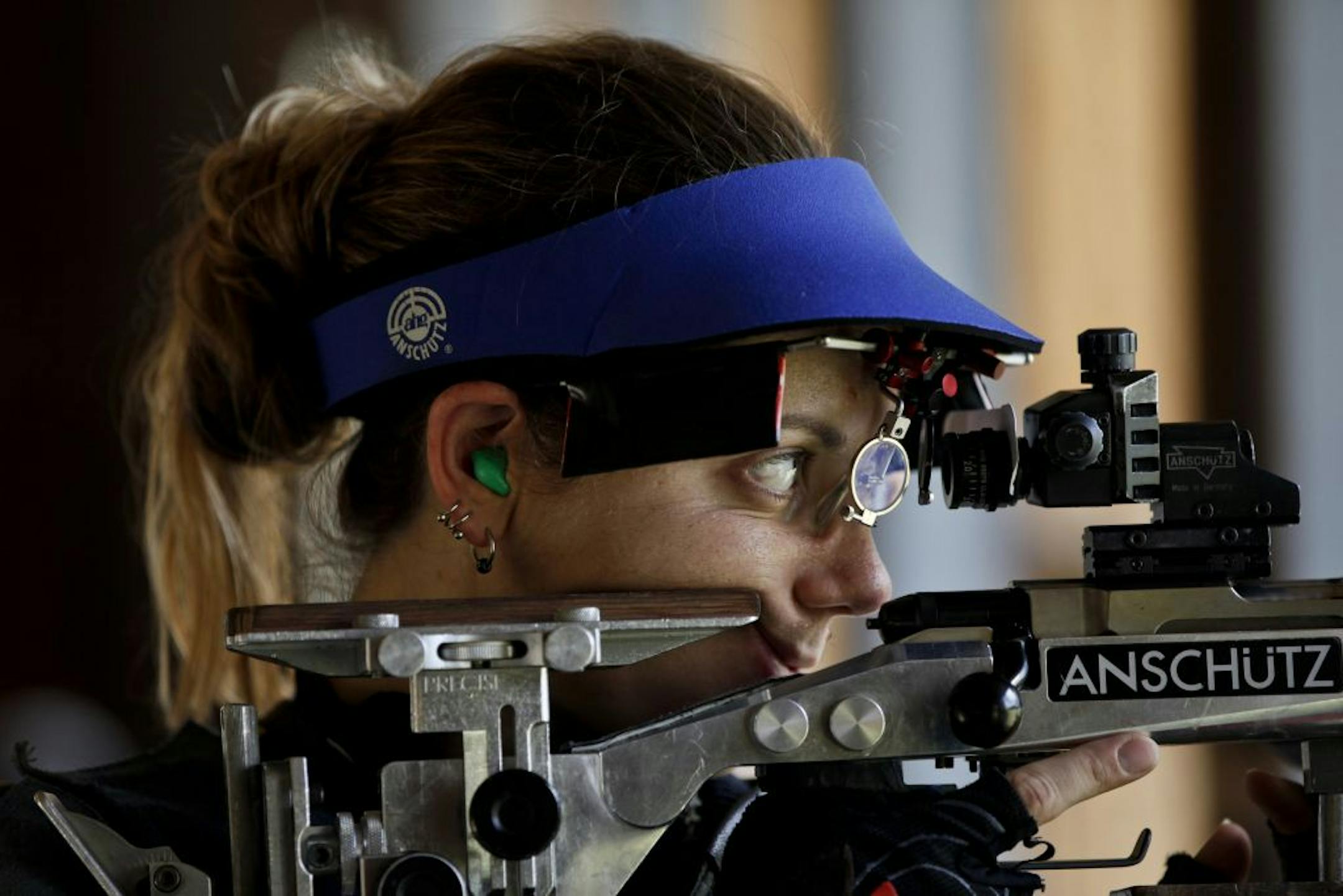 Jamie Gray, a member of the U.S. Olympic Shooting Team, practices shooting at a 50 meter range while standing in preparation for the 2012 summer London Olympics, in Elk River, Minn. Tuesday, July 3, 2012.