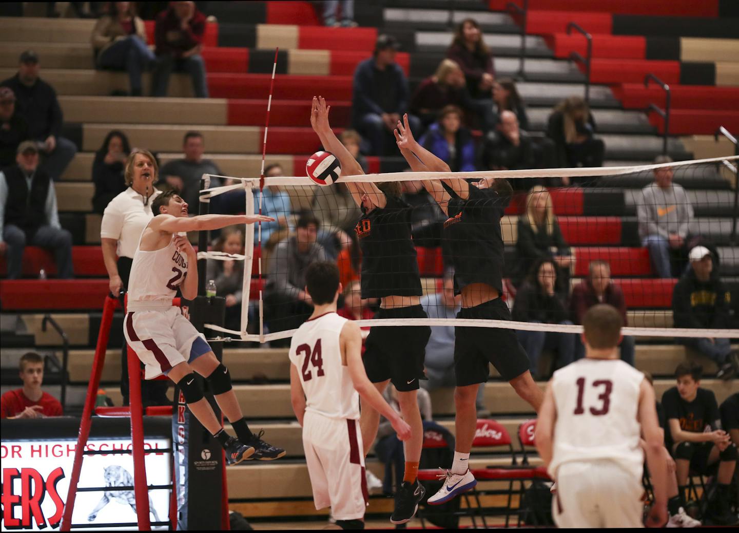 Lakeville South's Aiden Christensen (22), had his attack denied by Osseo's Kirby Schmalz and Cameron Wresh, right, in a tournament game played in April 2018 in Shakopee.