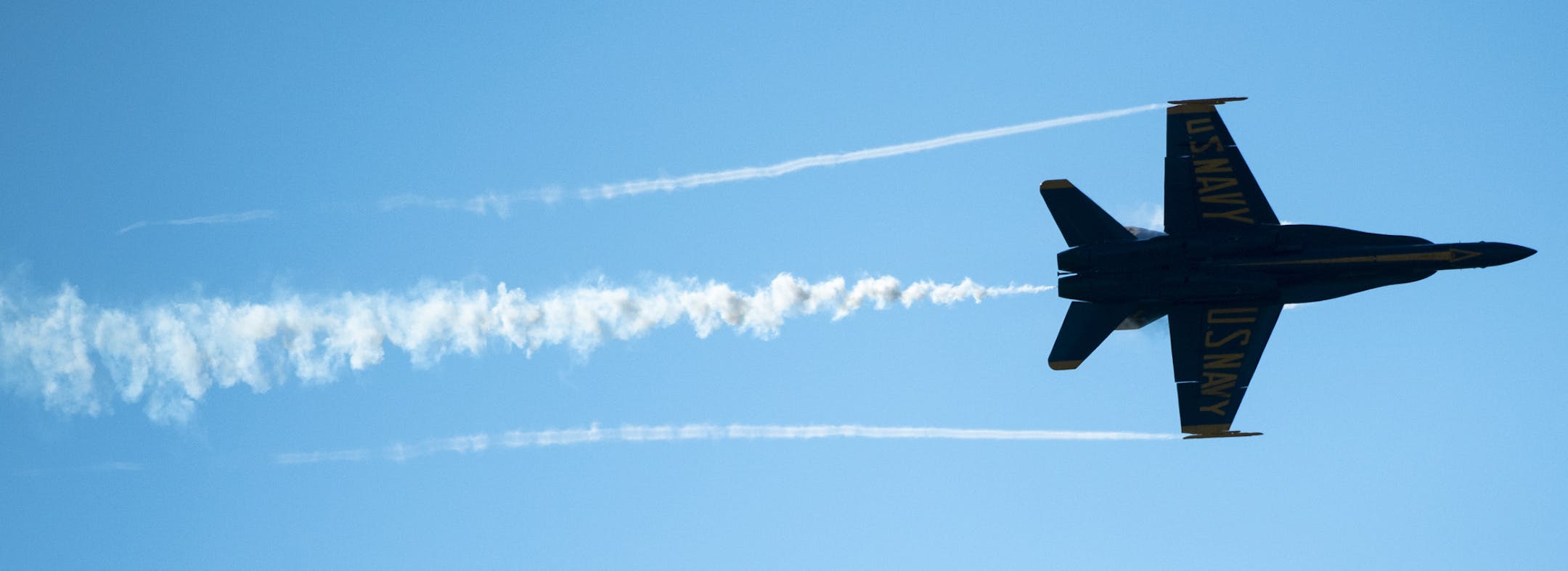 Blue Angels 7 left a cloud of white smoke as it flew over Duluth International Airport Wednesday afternoon with Star Tribune reporter Pam Louwagie onboard. ] Aaron Lavinsky ¥ aaron.lavinsky@startribune.com On the eve of the annual Duluth Air Show, staff writer Pam Louwagie and Minnesota Teacher of the Year Jess Davis fly with the Blue Angels. We photograph Louwagie and Davis on Wednesday, July 17, 2019 at the Duluth International Airport in Duluth, Minn.