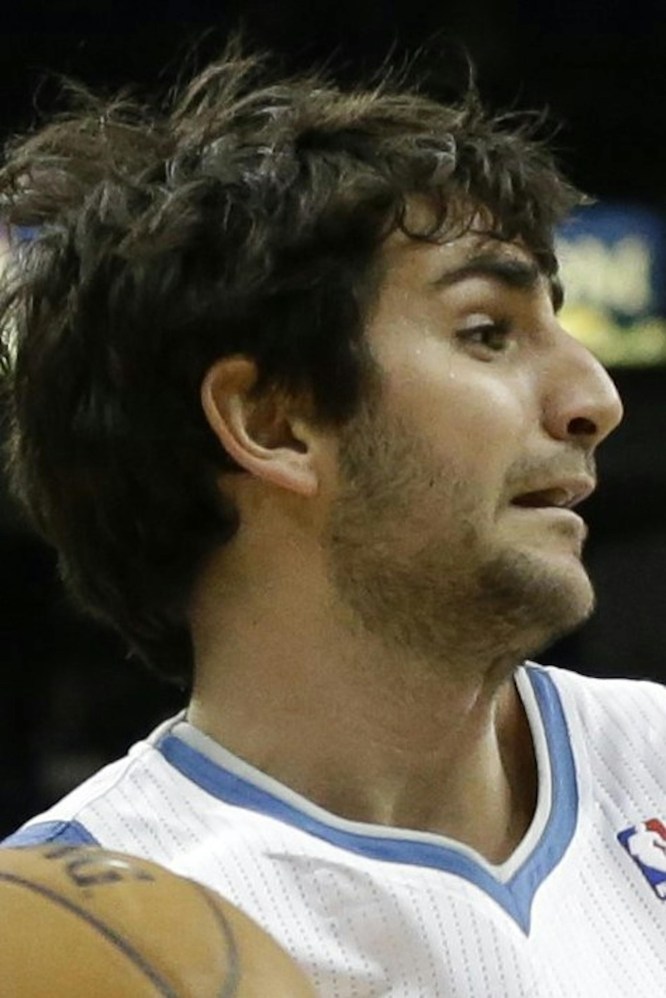 Minnesota Timberwolves' Ricky Rubio, left, of Spain, drives against Phoenix Suns' Markieff Morris in the first quarter of an NBA basketball game on Saturday, April 13, 2013, in Minneapolis. Rubio led the Timberwolves with 24 points and 10 assists while Morris led the Suns with 20 points. (AP Photo/Jim Mone)