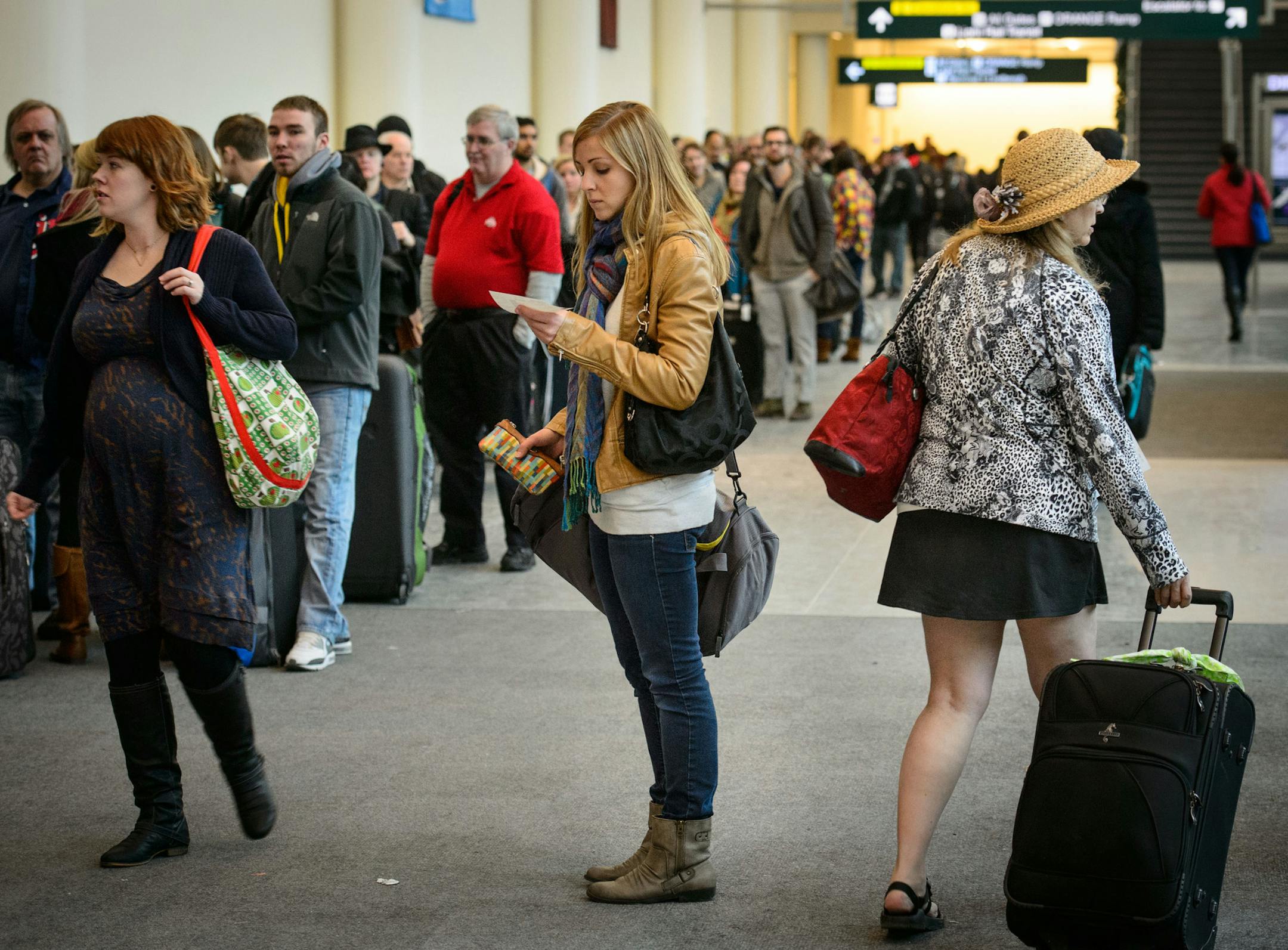 Operations were returning to normal at Terminal 2 at the Minneapolis-St. Paul International Airport but long lines remained mid morning at the Southwest Airlines counter as passengers were rescheduled. A suspicious package prompted an evacuation shortly after 6 a.m., delaying flights. Friday, December 20, 2013. ] GLEN STUBBE * gstubbe@startribune.com