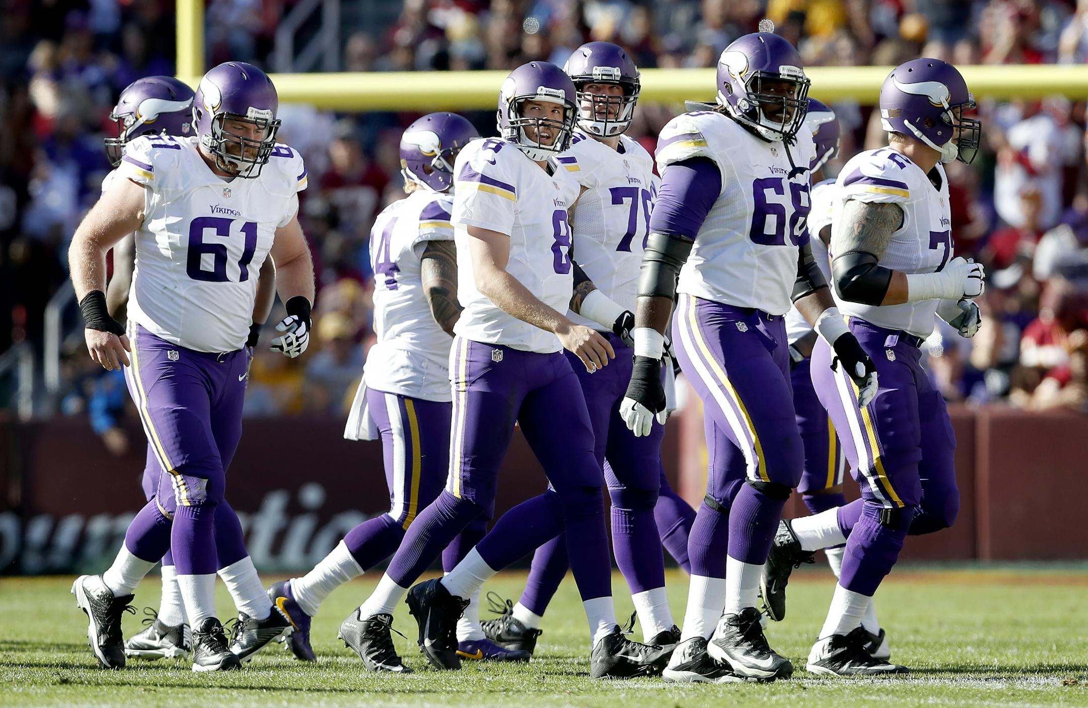 Minnesota Vikings Sam Bradford (8) and the offensive line.