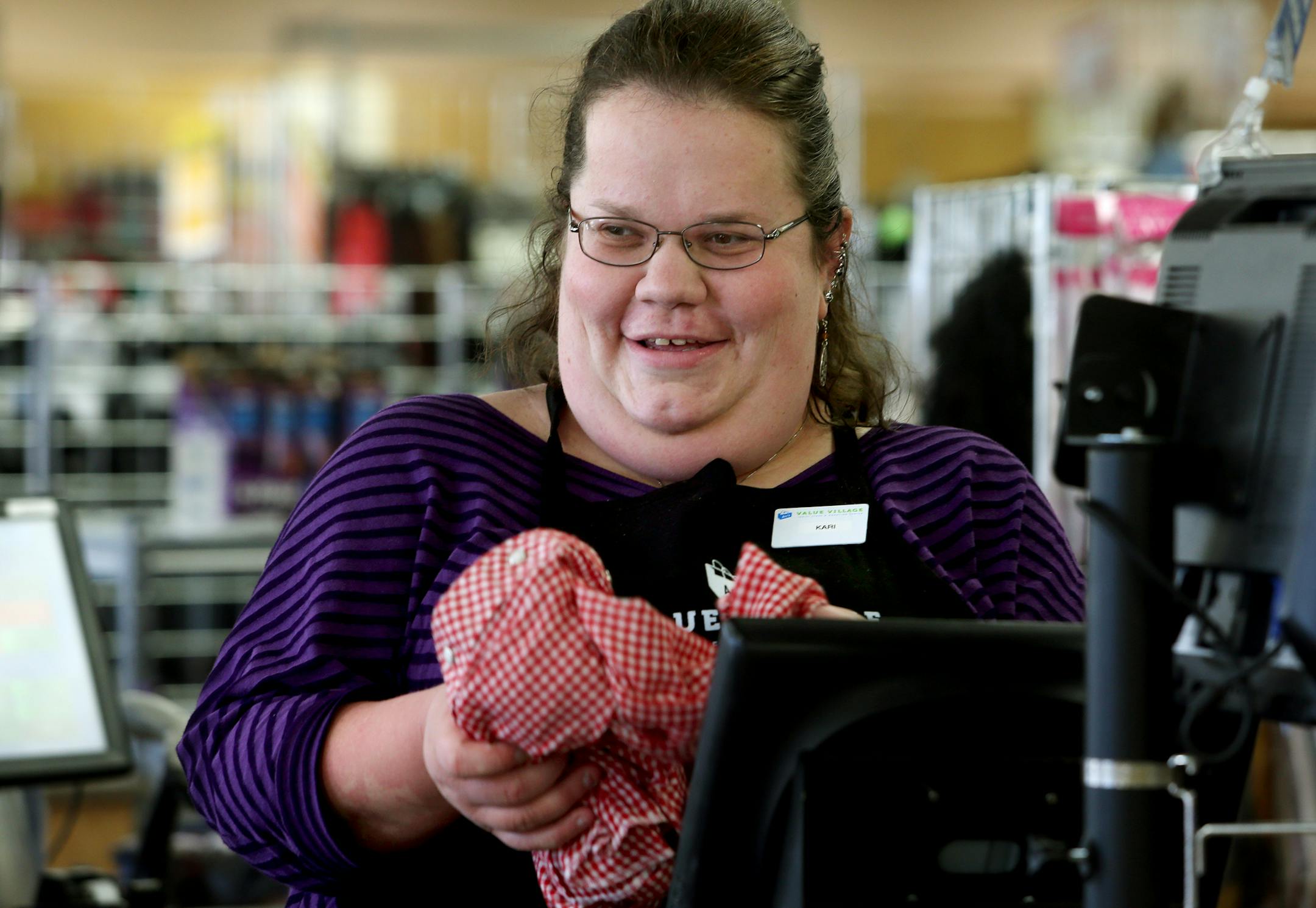 Kari Thayer, a graduate of Minnesota Life College, now works at Value Village in Richfield, MN on October 9, 2013. ] JOELKOYAMA‚Ä¢joel koyama@startribune