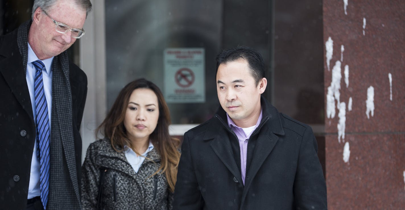 Koua Fong Lee stood with his wife Panghoua Moua, center, and attorney Bob Hilliard, left, after a verdict in the Toyota liability trial that found the automaker 60 percent responsible and Lee 40 percent responsible for a 2006 crash that caused the deaths of three people and sent a St. Paul man to prison for more than two years, outside the Federal Courthouse in downtown Minneapolis, Minn. on Tuesday, February 3, 2015. ] RENEE JONES SCHNEIDER &#x2022; reneejones@startribune.com