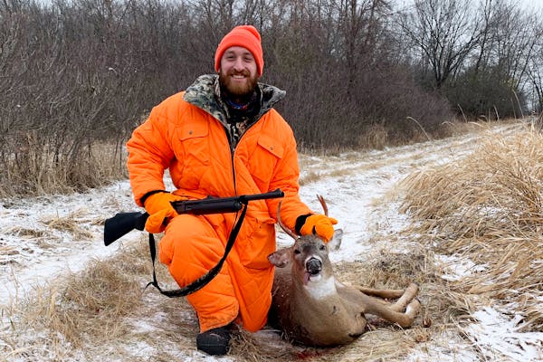 Sam Harris of Maple Grove with the spike buck he shot during firearms season at his family's camp near Fergus Falls