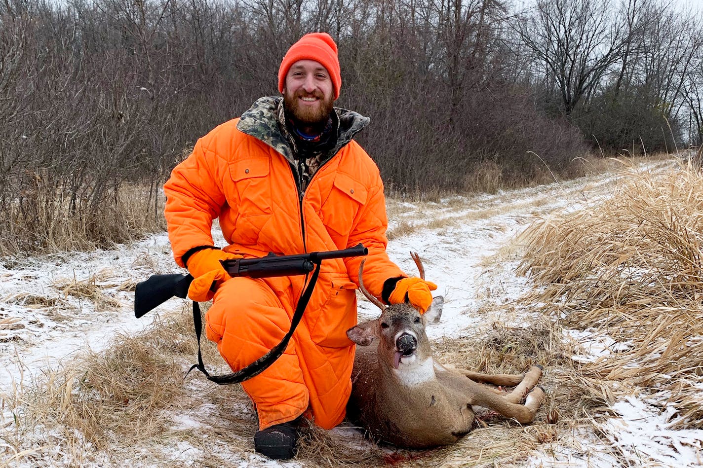 Sam Harris of Maple Grove with the spike buck he shot during firearms season at his family's camp near Fergus Falls