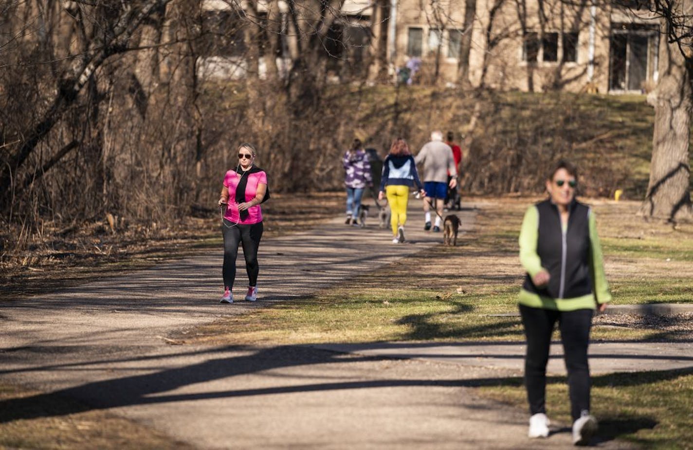 Walkers kept their distance from each other at Todd Park in Edina. Gov. Tim Walz called his stay-at-home order "one of the biggest differences that we can make."