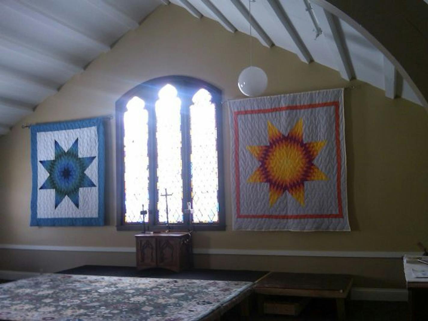 The blue quilt is from White Earth Reservation; the gold quilt is from
All Saints' Indian Mission in Minneapolis. Both were ripped down and
stolen on March 2.