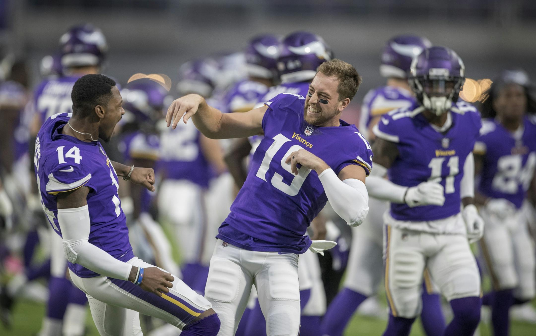 Minnesota Vikings wide receiver Stefon Diggs (14) left a receiver Adam Thielen (19) played around as the offense was introduced at U.S. Bank Stadium Sunday October 14, 2018 in Minneapolis, MN.