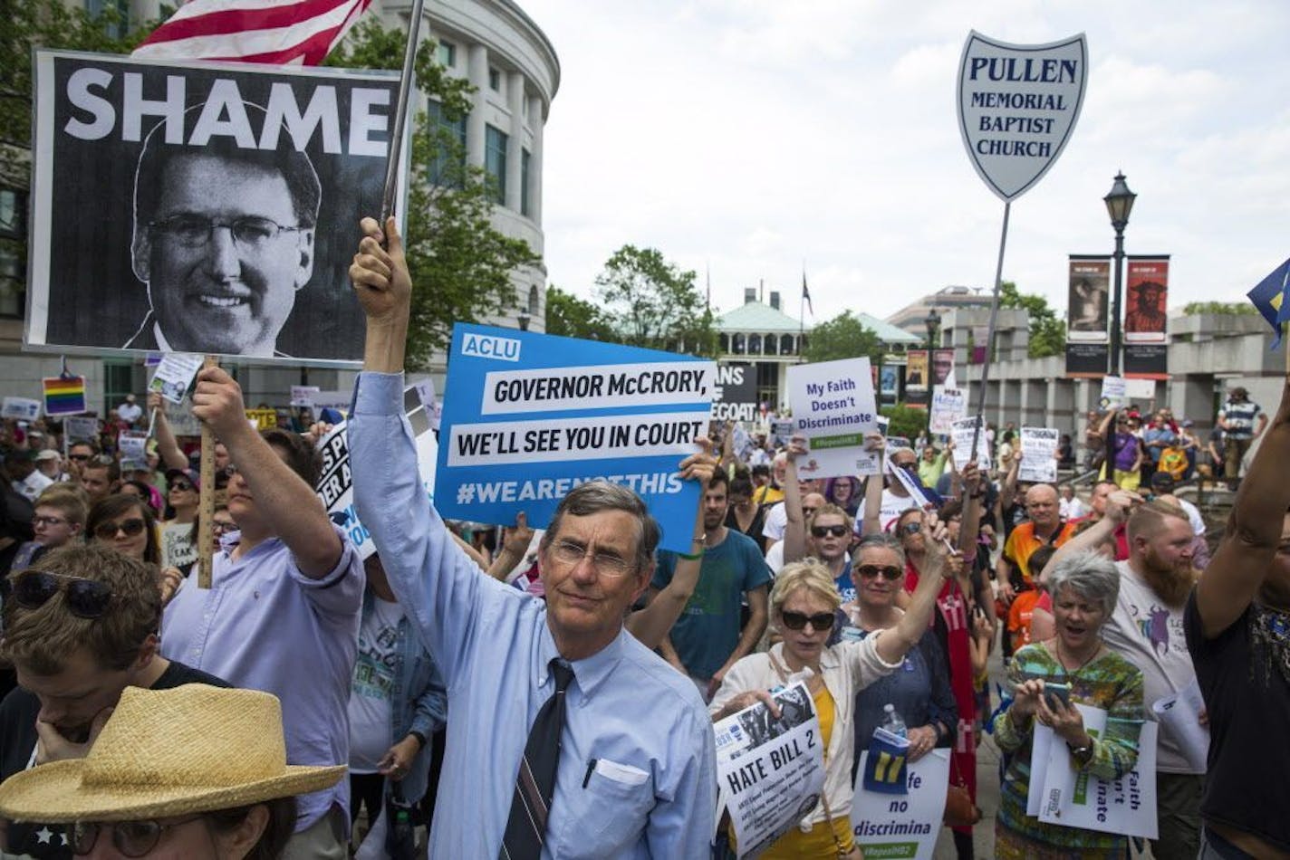 FILE � Protesters against North Carolina�s transgender bathroom law rally near the Old State Capitol Building in Raleigh, N.C., April 25, 2016. The Justice Department on May 4 warned state officials that they would lose millions of dollars in federal funding unless they change the controversial measure because they are in violation of federal civil rights law, a law enforcement official said.