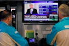 Specialists on the floor of the New York Stock Exchange watch President Donald Trump's news conference Wednesday, Nov. 7, 2018. Technology and health 