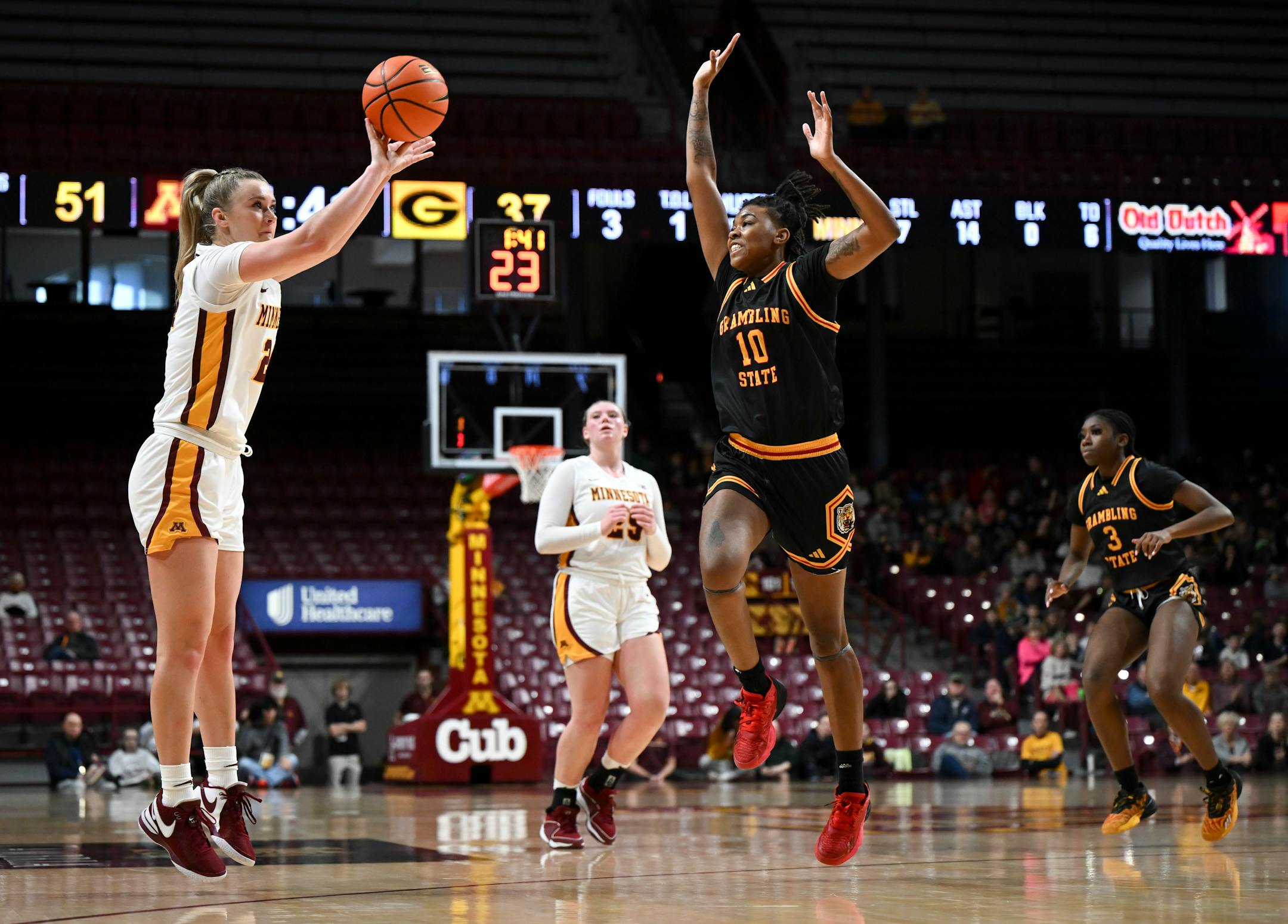 Minnesota Gophers forward Mallory Heyer (24) attemps a 3-pointer as she's defended by Grambling Lady Tigers forward Brenda McKinney (10) in the second quarter.