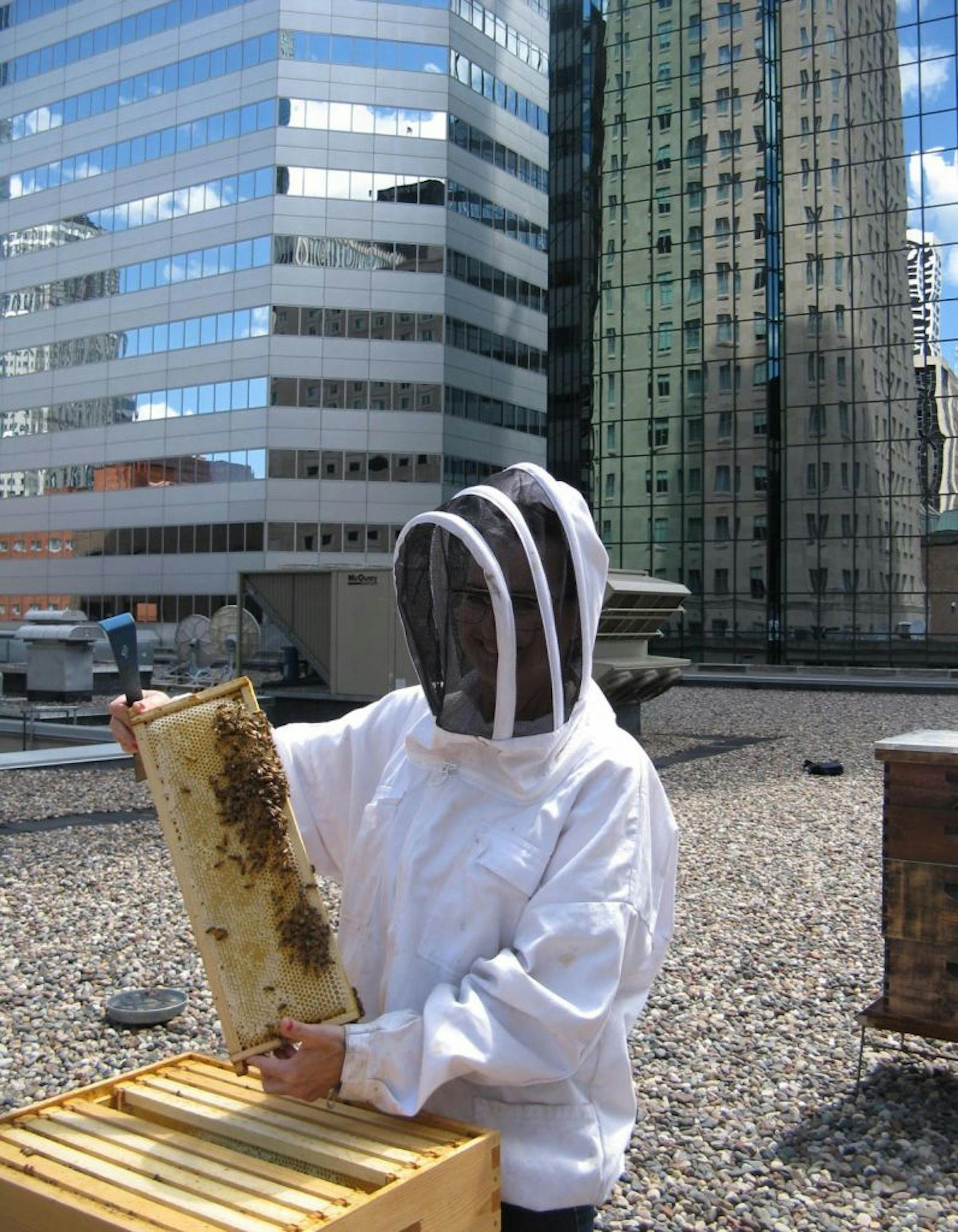 On the roof of the W Hotel Minneapolis, with beekeeper Susan Brown.
