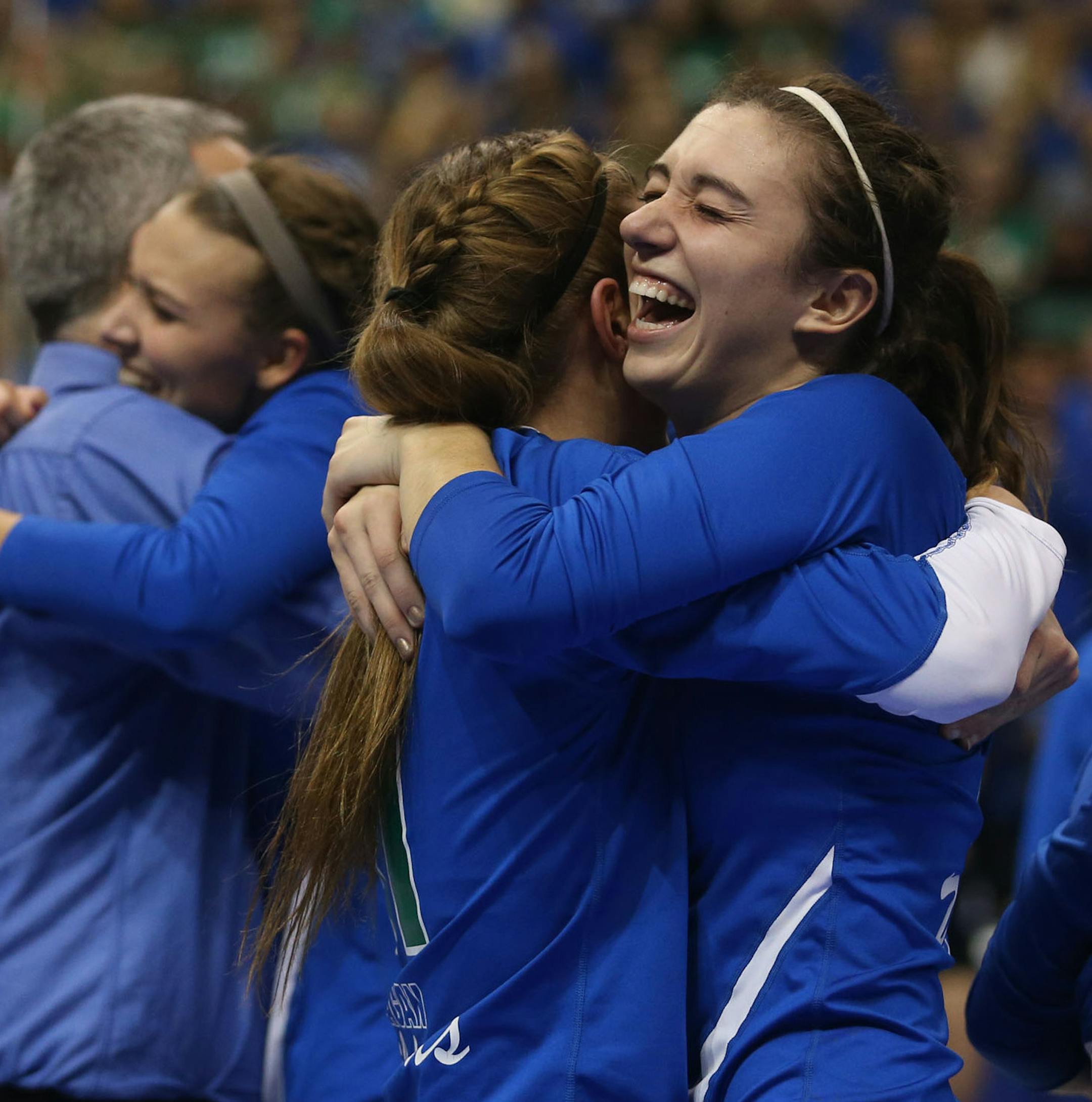 Eagan's Callie Schapekahm, left, hugged teammate Celia Bertsch after winning the state championship Class 3A finals at the Xcel Energy Center in St. Paul, Min., Saturday, November 9, 2013. Eagan won over Delano 3-2. ] (KYNDELL HARKNESS/STAR TRIBUNE) kyndell.harkness@startribune.com
